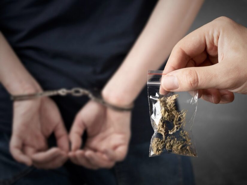 Marijuana Bag With A Handcuffed Person in the Background