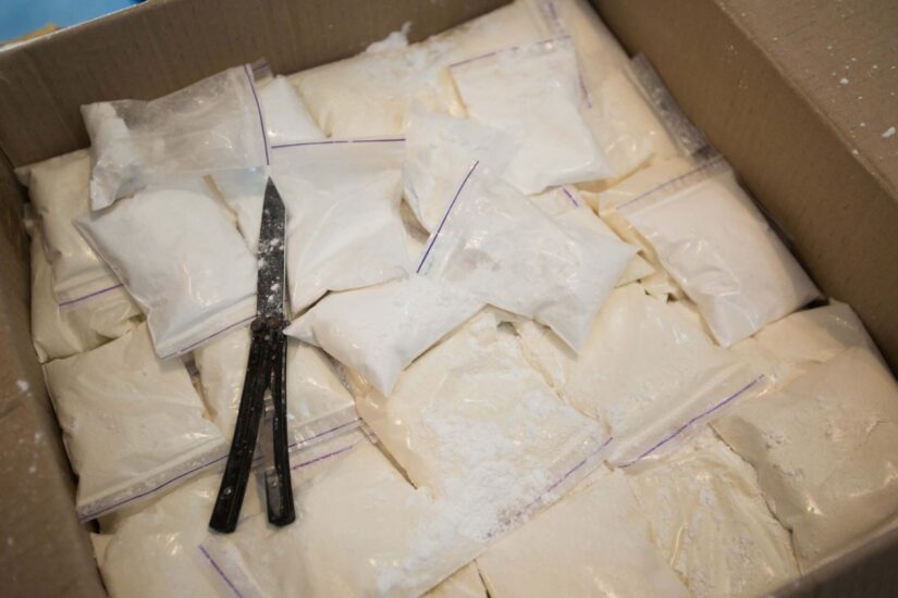 Plastic bags with cocaine are sealed in a box